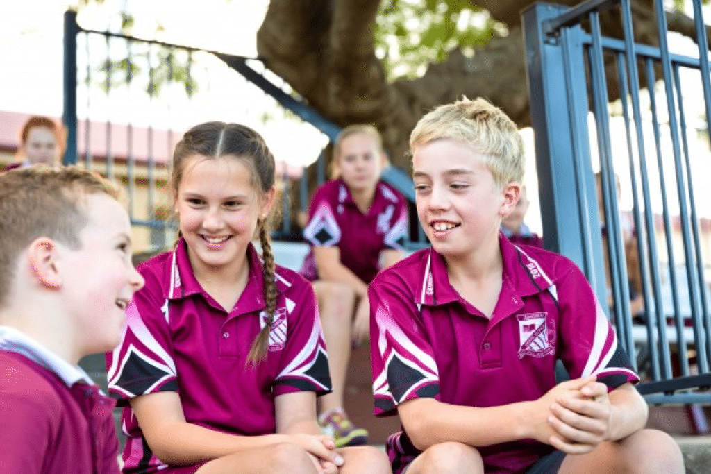 A group of students from Ashgrove State School talking and smiling